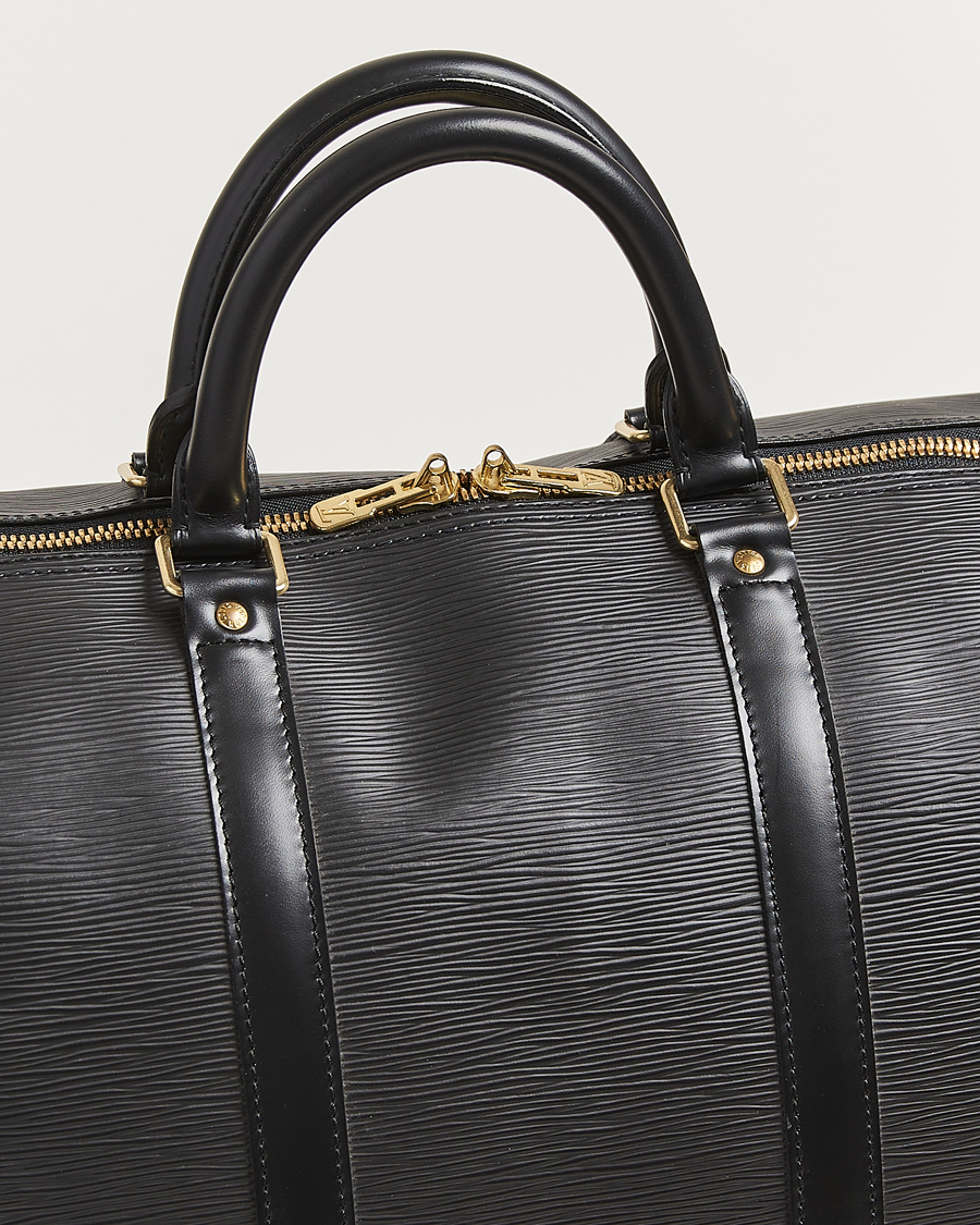 Homme | Louis Vuitton Pre-Owned Keepall 55 Epi Leather Bag Black | Louis Vuitton Pre-Owned | Keepall 55 Epi Leather Bag Black
